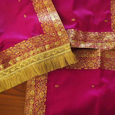 Pink and gold silk sari with intricate patterns